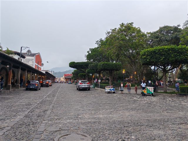 A cobbled street in Antigua Guatemala with the volcano behind A cobbled street in Antigua Guatemala with the volcano behind