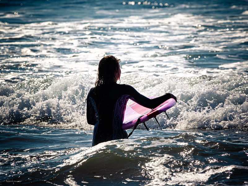 Heading out with a board at dusk